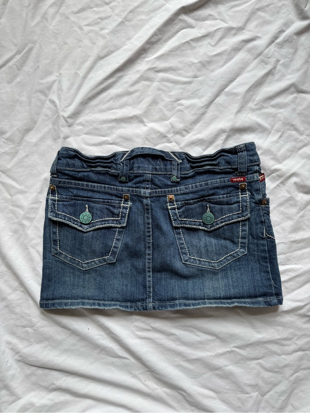 Moto blue denim mini skirt with white stitching and pockets